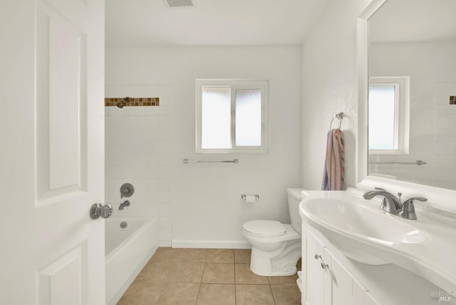 full bathroom with vanity, tiled shower / bath, tile patterned floors, and toilet