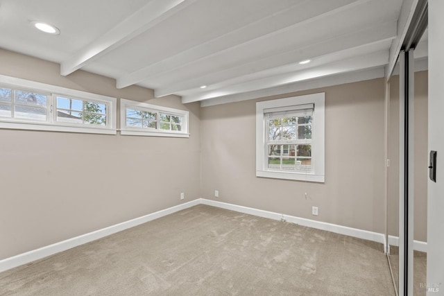 basement featuring carpet, baseboards, and recessed lighting