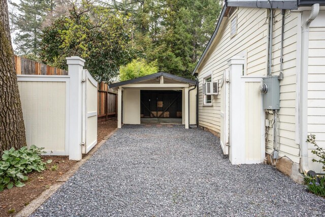 view of side of property with a garage and an outdoor structure