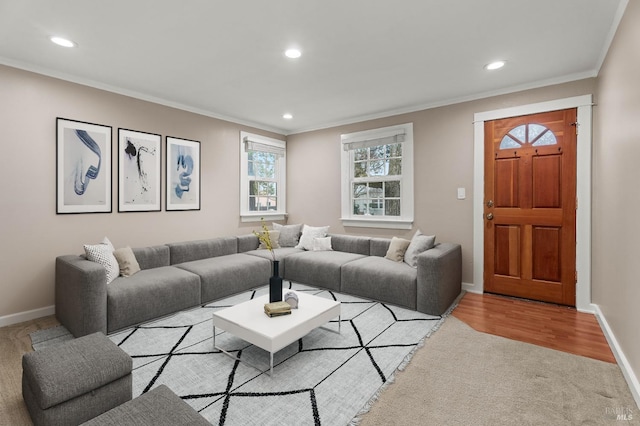 living room featuring ornamental molding, recessed lighting, light wood-type flooring, and baseboards