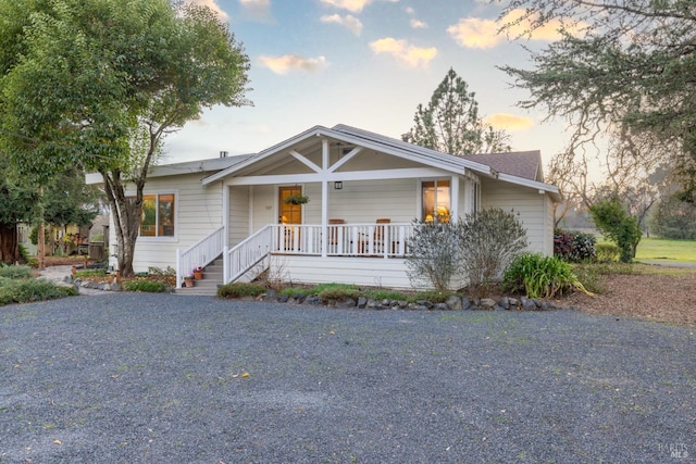 ranch-style house with covered porch