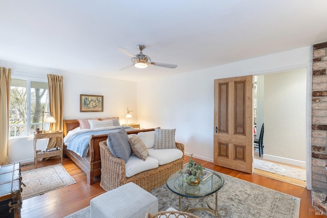 bedroom featuring wood-type flooring and ceiling fan