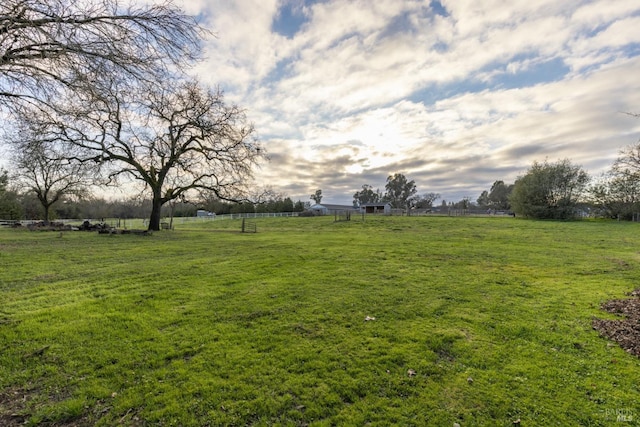 view of yard with a rural view