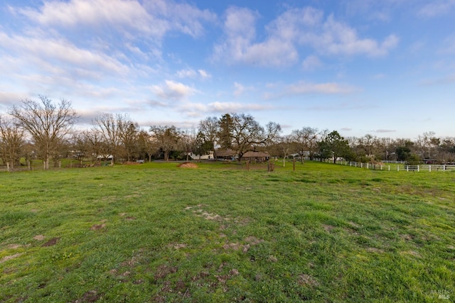 view of yard with a rural view