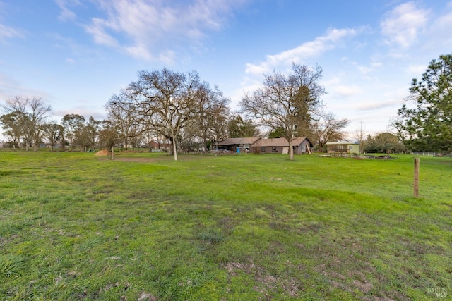 view of yard with a rural view