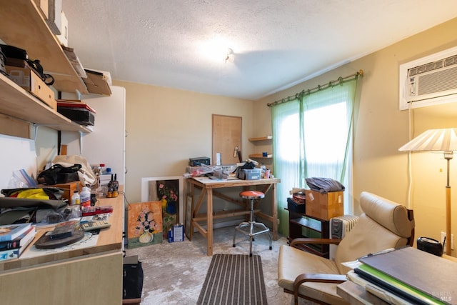 office with a wall unit AC and a textured ceiling