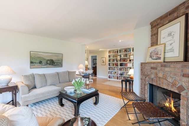 living room with a fireplace and light hardwood / wood-style floors