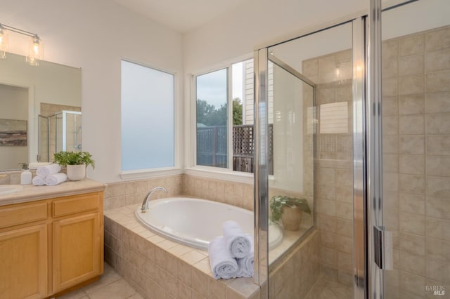 bathroom with vanity, tile patterned floors, and independent shower and bath