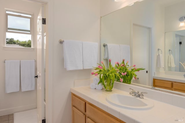 bathroom with washtub / shower combination and vanity