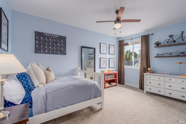 carpeted bedroom with ceiling fan