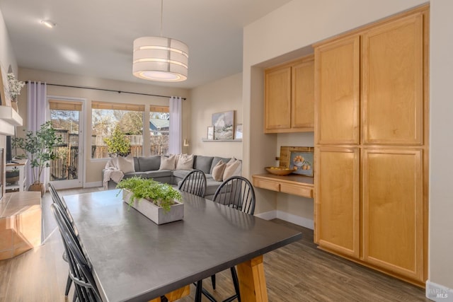 dining area with dark hardwood / wood-style floors