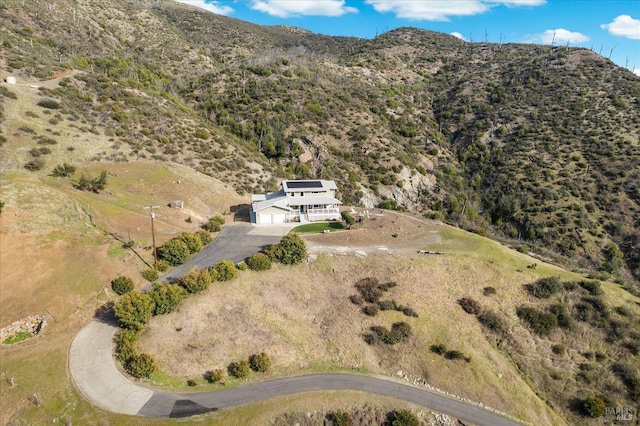 birds eye view of property featuring a mountain view