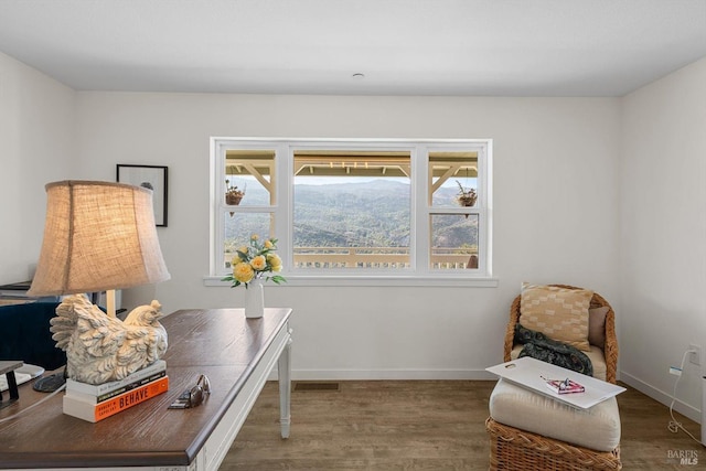 office space with baseboards and dark wood finished floors