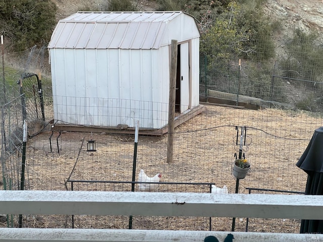 view of outdoor structure with an outdoor structure and fence