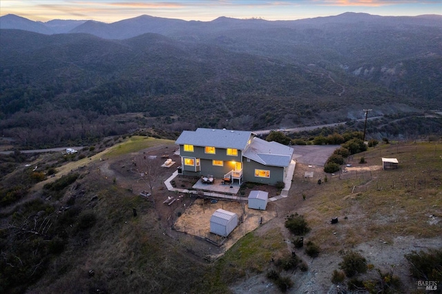 aerial view at dusk with a mountain view