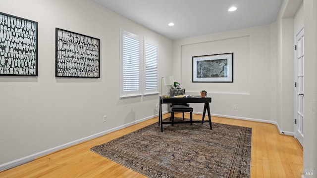 home office featuring hardwood / wood-style floors