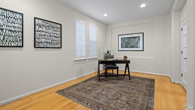 home office with baseboards, wood finished floors, and recessed lighting
