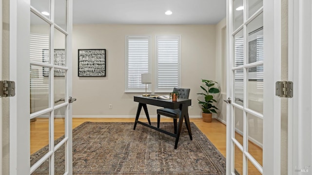 office area with recessed lighting, wood finished floors, baseboards, and french doors