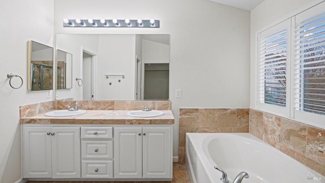 bathroom with vanity and a bathtub