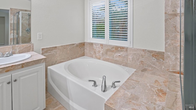 bathroom featuring vanity and plus walk in shower