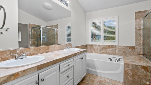 bathroom featuring vanity, vaulted ceiling, and plus walk in shower