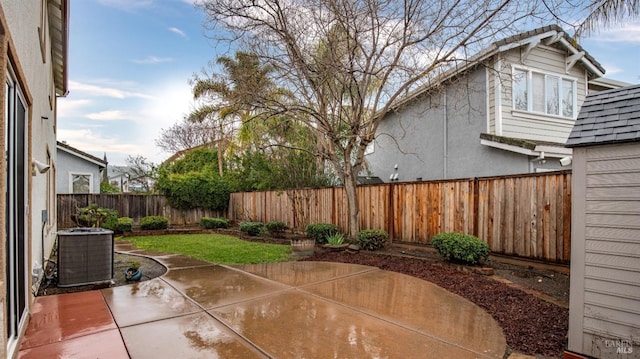 view of patio / terrace featuring central air condition unit and a fenced backyard