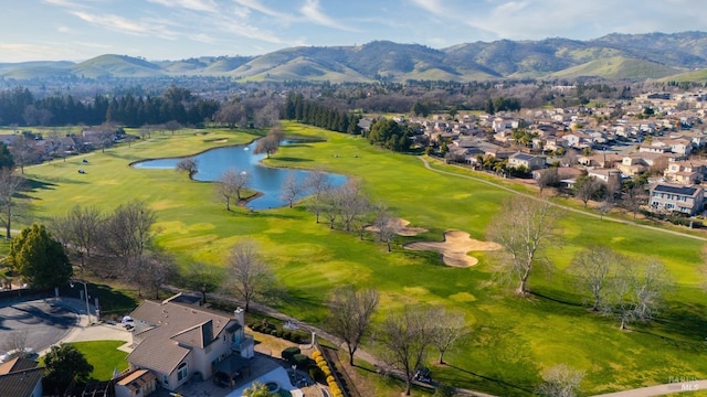 aerial view featuring a residential view, view of golf course, and a water and mountain view