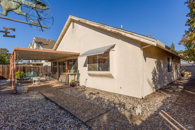 back of property with a patio area