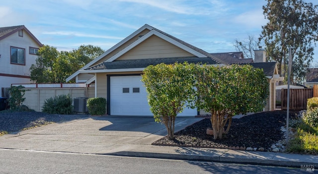 view of front of house featuring a garage and central air condition unit