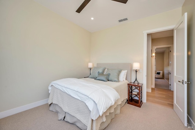 carpeted bedroom with ceiling fan