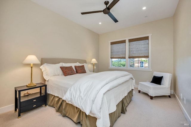 bedroom with light carpet and ceiling fan