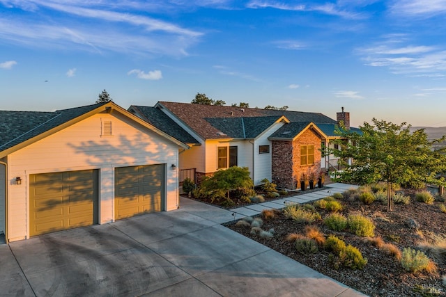 ranch-style house featuring a garage