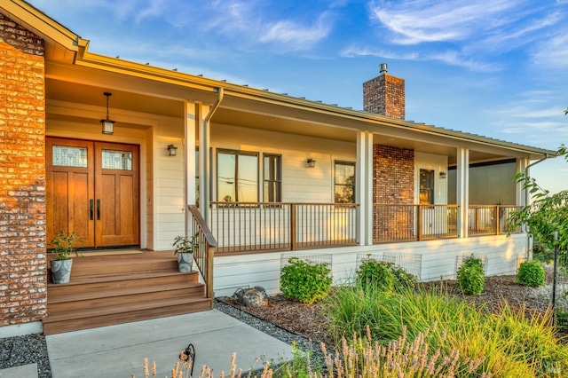 doorway to property with covered porch