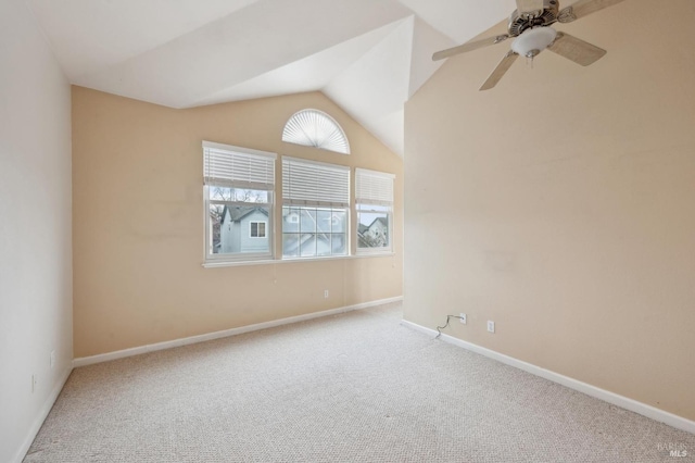 unfurnished room featuring lofted ceiling, carpet floors, and ceiling fan