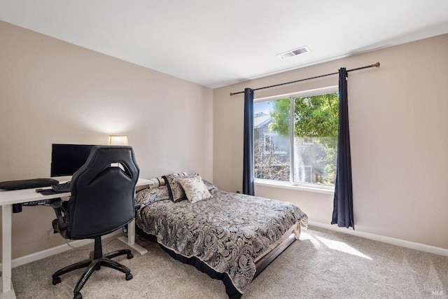 bedroom featuring light colored carpet