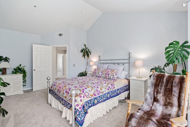 carpeted bedroom featuring lofted ceiling