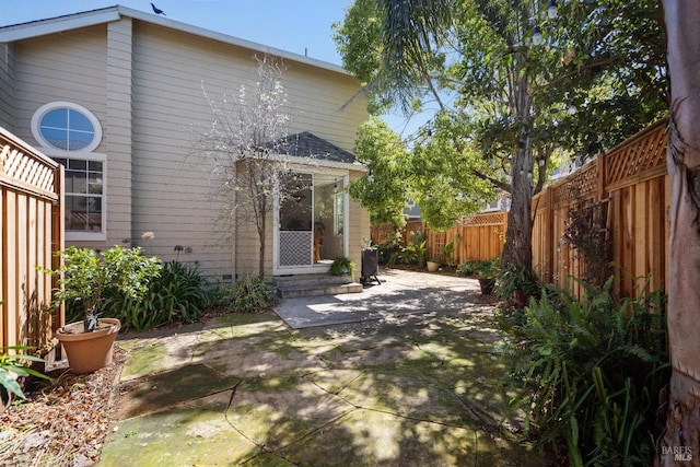 rear view of property featuring a patio