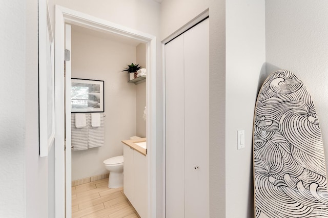57 Lakeshore Ct, Richmond, CA 94804 - bathroom with toilet, vanity, and wood finished floors