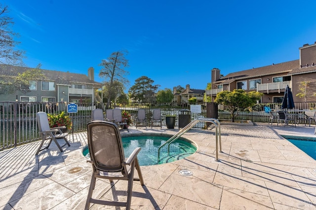 57 Lakeshore Ct, Richmond, CA 94804 - view of swimming pool featuring fence, a patio area, a pool, and a residential view