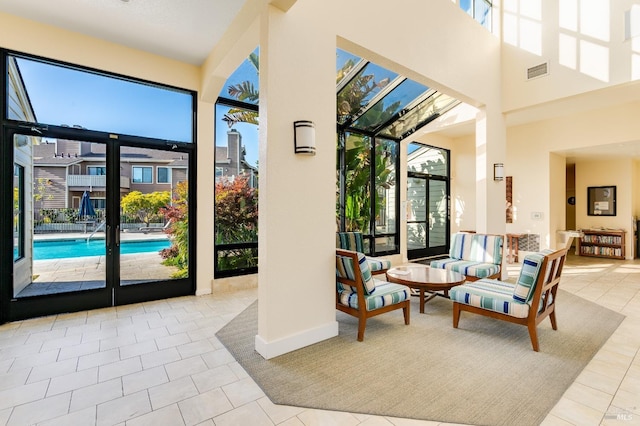57 Lakeshore Ct, Richmond, CA 94804 - entryway with a high ceiling, a sunroom, tile patterned floors, and visible vents