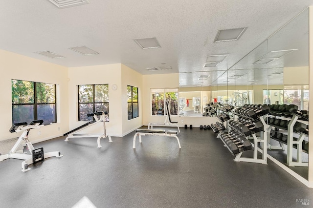 57 Lakeshore Ct, Richmond, CA 94804 - exercise room with a wealth of natural light and a textured ceiling