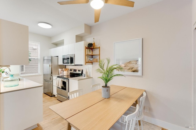 57 Lakeshore Ct, Richmond, CA 94804 - interior space featuring white cabinets, a sink, a ceiling fan, light countertops, and appliances with stainless steel finishes