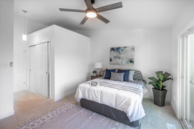 carpeted bedroom with lofted ceiling and ceiling fan