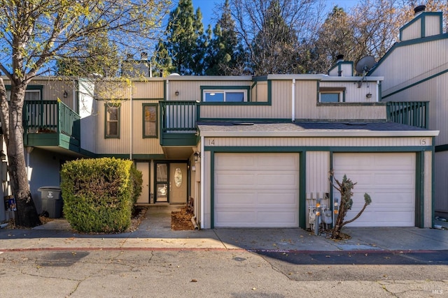 multi unit property featuring a garage