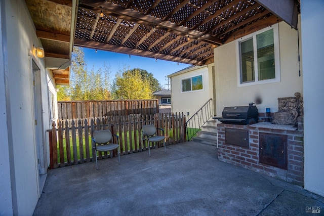 view of patio / terrace with a pergola and exterior kitchen