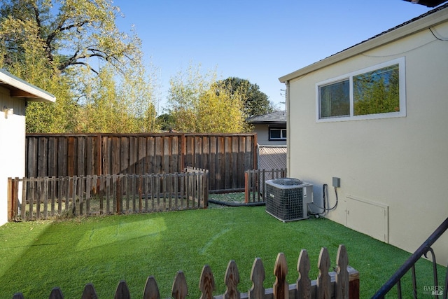 view of yard featuring central air condition unit