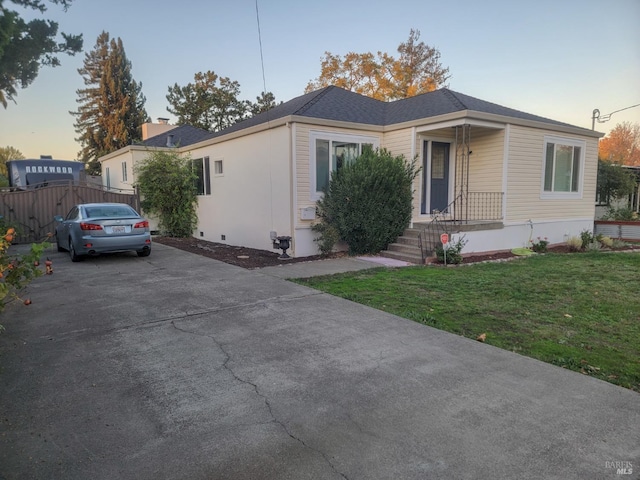 ranch-style house with a lawn