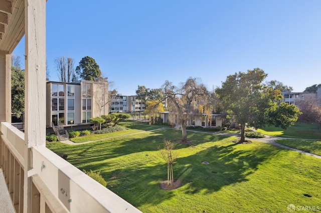 view of home's community featuring a yard