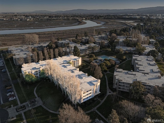 birds eye view of property featuring a mountain view