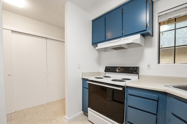 kitchen with a textured ceiling, range with electric cooktop, blue cabinets, and under cabinet range hood